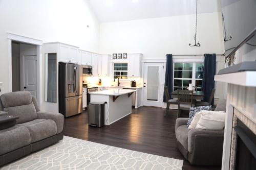 a kitchen and living room with a couch and a table at Highway Oasis and Myrtle Beach in Arrowood