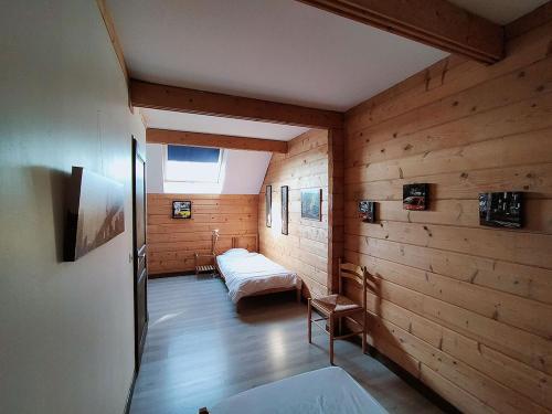 Postel nebo postele na pokoji v ubytování Aux Gîtes d'Orient