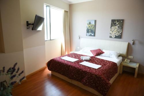 Ένα ή περισσότερα κρεβάτια σε δωμάτιο στο Hotel Sole