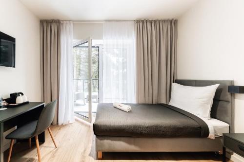 Ένα ή περισσότερα κρεβάτια σε δωμάτιο στο Apartamenty Wyszogrodzka 64