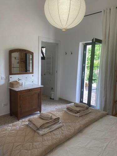 Ένα ή περισσότερα κρεβάτια σε δωμάτιο στο Villa Raffaele