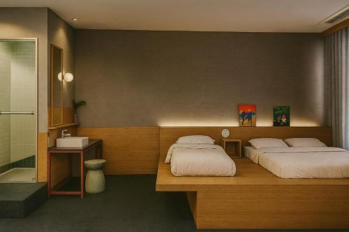 Postel nebo postele na pokoji v ubytování Stay Ohana