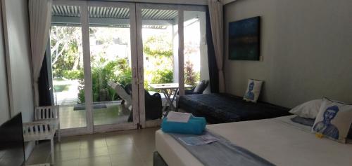 Ένα ή περισσότερα κρεβάτια σε δωμάτιο στο the Oasis