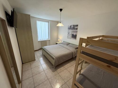 Postel nebo postele na pokoji v ubytování Il Raponzolo di Roccia