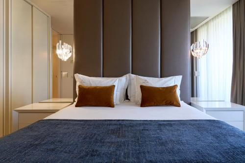 Postel nebo postele na pokoji v ubytování Serviced Apartments Boavista Palace