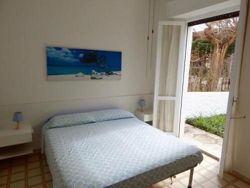 Ένα ή περισσότερα κρεβάτια σε δωμάτιο στο Marcelli, trilocale con giardino a 200mt dal mare