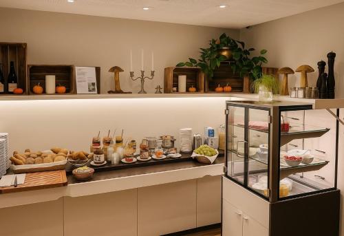 a kitchen with a counter with food on it at Römerhof in Stuttgart