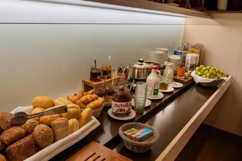 a refrigerator filled with lots of different types of food at Römerhof in Stuttgart