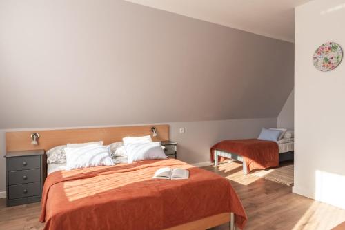 Postel nebo postele na pokoji v ubytování Willa Widok