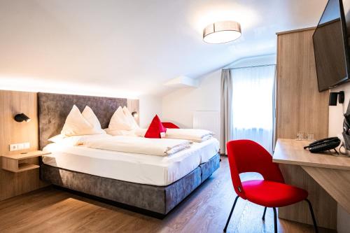 Ένα ή περισσότερα κρεβάτια σε δωμάτιο στο Hotel Rosenvilla