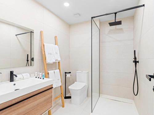 a bathroom with a sink and a toilet at The Hills Residence at Simpson Bay in Simpson Bay