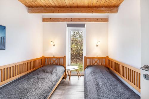 Ένα ή περισσότερα κρεβάτια σε δωμάτιο στο Schilfuferhaus