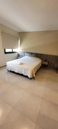 Ένα ή περισσότερα κρεβάτια σε δωμάτιο στο Departamentos Premium