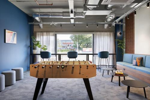 a room with a table with a game at For Students Only Westfield in Edinburgh in Edinburgh