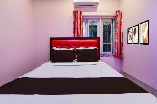 Ένα ή περισσότερα κρεβάτια σε δωμάτιο στο Hotel O Vedika Acropolis Mall