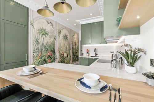 a kitchen with a table with two cups on it at 1 Bed Flat in London in London