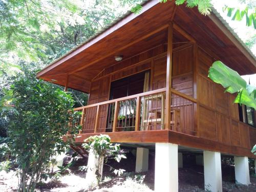 a tree house with a balcony in the woods at Rancho de Lelo Ecolodge in Monteverde Costa Rica