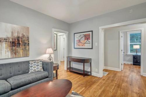 a living room with a couch and a table at Beautiful Brand New Tower Grove Unit 1s in Clifton Heights