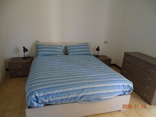 Ένα ή περισσότερα κρεβάτια σε δωμάτιο στο Il Posto Giusto