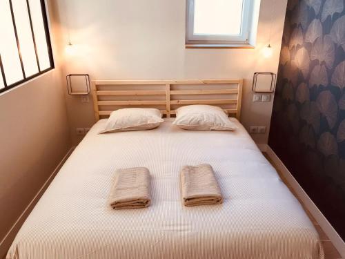 Ένα ή περισσότερα κρεβάτια σε δωμάτιο στο Charmant Studio Balneo wifi clim borne electrique