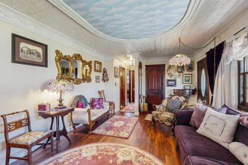 a living room with a couch and chairs at Ranchita Avalon in Sierraville