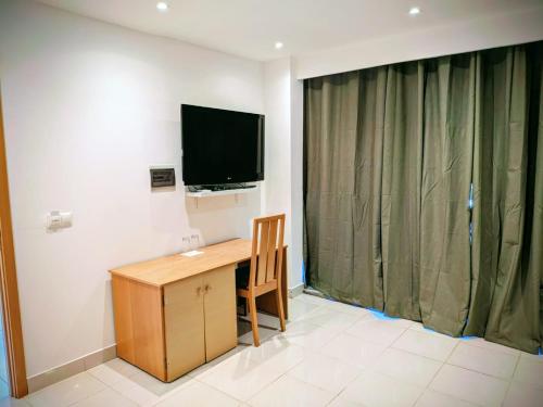 TV a/nebo společenská místnost v ubytování Strela Hotel Cachoeira