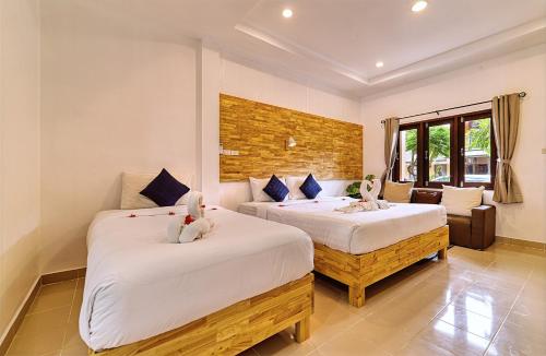Giường trong phòng chung tại The Bulin Residence