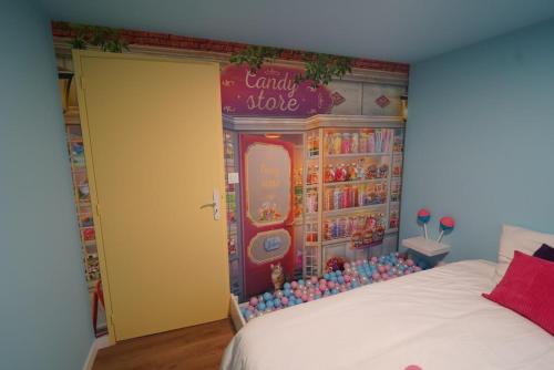 Ένα ή περισσότερα κρεβάτια σε δωμάτιο στο Le Candy by Clem