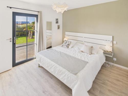Ένα ή περισσότερα κρεβάτια σε δωμάτιο στο Maison moderne pour 8 - 300m plage de Pors Carn