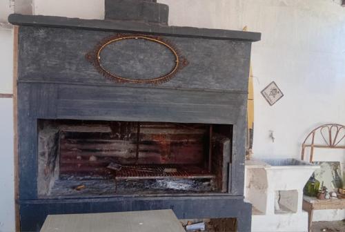 a fireplace with a wreath on top of it at Departamentos Tala y Tuyú in San Clemente del Tuyu