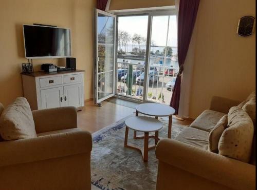 a living room with a couch and a table at Orth C19 in Orth