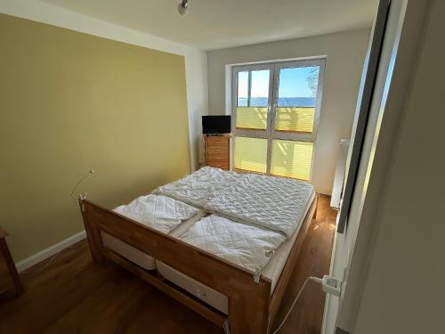 a bedroom with a bed and a window at Schöne Aussicht in Orth