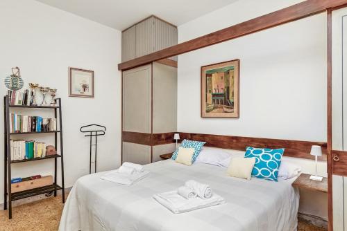 En eller flere senge i et værelse på Portoseaview Terrace & AC