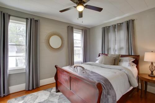 a bedroom with a bed and a ceiling fan at Charming Cottage with Mississippi River Views! in Natchez