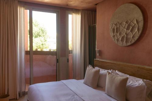 Postel nebo postele na pokoji v ubytování Laiva Hotel San Jose by Tasman