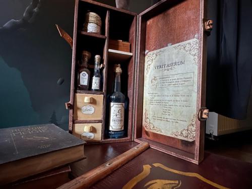 a briefcase filled with bottles of wine on a table at Le Nimbus by Clem in Pélussin