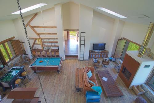 an aerial view of a living room with a pool table at Casona Alto Sarracin in Lloreda