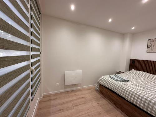 Postel nebo postele na pokoji v ubytování Havre de paix en ville - chez Céline