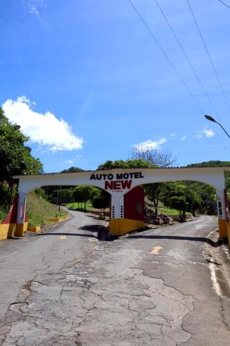 an auto neglect new sign on the side of a road at New Auto Motel in Barcelona