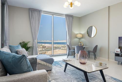 a living room with a couch and a table at Urban Chic - Shams Meera in Abu Dhabi