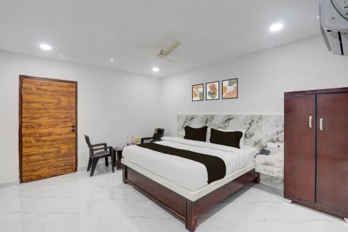 Ένα ή περισσότερα κρεβάτια σε δωμάτιο στο Hotel O Bluemoon