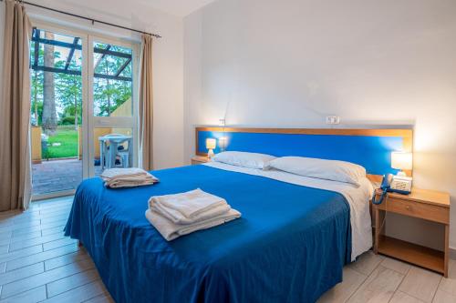 Ένα ή περισσότερα κρεβάτια σε δωμάτιο στο La Feluca