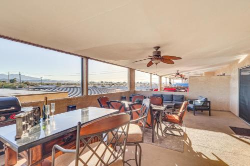 a living room with a table and chairs at Walkable Location! Waterfront Lake Havasu Paradise in Lake Havasu City