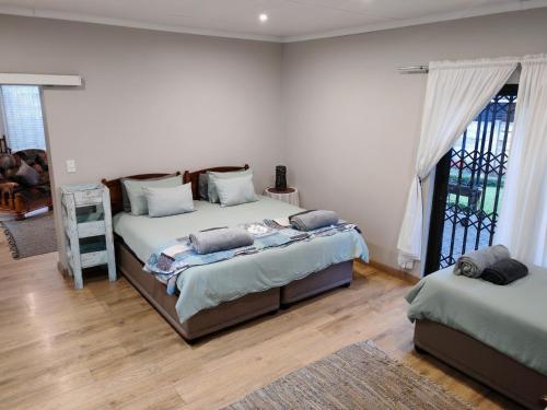 Ένα ή περισσότερα κρεβάτια σε δωμάτιο στο Kardoesie