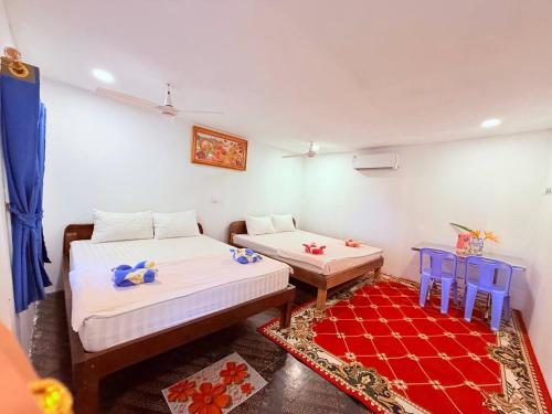 Ένα ή περισσότερα κρεβάτια σε δωμάτιο στο Sweet Jungle Bungalows