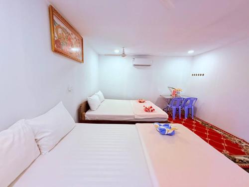 Ένα ή περισσότερα κρεβάτια σε δωμάτιο στο Sweet Jungle Bungalows