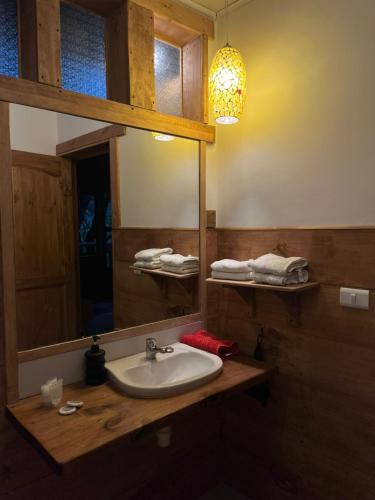 a bathroom with a sink and a mirror at Haiku Cabañas Panorámicas in San José de Maipo