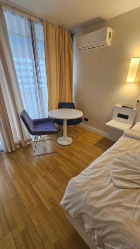 Un pat sau paturi într-o cameră la BLACK SEA ORBI APARTAMENT s