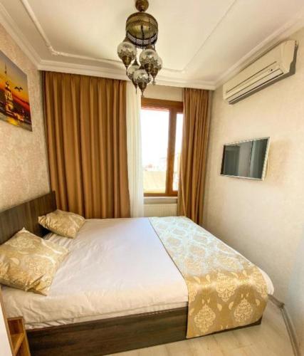 a bedroom with a bed and a window at My Home Premium in Sultanahmet