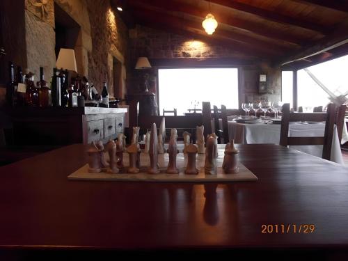 a chess set on a table in a restaurant at Casona Asturiana Los Gamonales in Logrezana